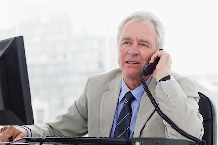 phone one person adult smile elderly - Senior manager on the phone in his office Stock Photo - Budget Royalty-Free & Subscription, Code: 400-06627062