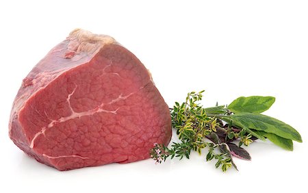 Fillet of beef meat joint with fresh herb sprigs over white background. Stock Photo - Budget Royalty-Free & Subscription, Code: 400-06628400