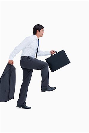 Side view of walking tradesman with jacket and suitcase against a white background Stock Photo - Budget Royalty-Free & Subscription, Code: 400-06634131
