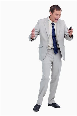 simsearch:400-06632132,k - Businessman getting good news via text message against a white background Stock Photo - Budget Royalty-Free & Subscription, Code: 400-06634715