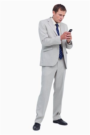 simsearch:400-06632132,k - Businessman reading text message against a white background Stock Photo - Budget Royalty-Free & Subscription, Code: 400-06634713