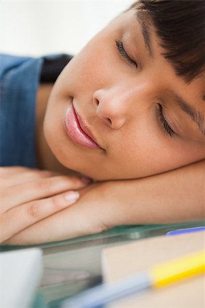 Close-up of a smiling student sleeping on her desk Stock Photo - Budget Royalty-Free & Subscription, Code: 400-06637233