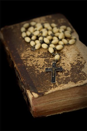 Ancient book with prayer beads on black background Stock Photo - Budget Royalty-Free & Subscription, Code: 400-06639153