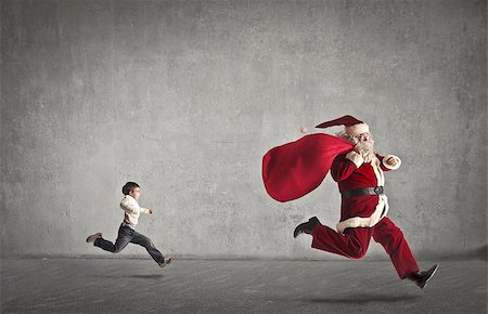 Child running after Santa Claus Stock Photo - Budget Royalty-Free & Subscription, Code: 400-06639884