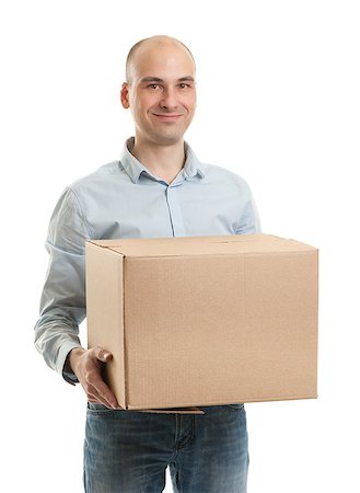Young man holding cardboard box Stock Photo - Budget Royalty-Free & Subscription, Code: 400-06630786
