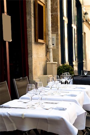 Street view of a coffee terrace with tables and chairs,paris France Stock Photo - Budget Royalty-Free & Subscription, Code: 400-06631252