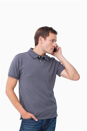 simsearch:400-06632132,k - Young man on the cellphone against a white background Stock Photo - Budget Royalty-Free & Subscription, Code: 400-06632136