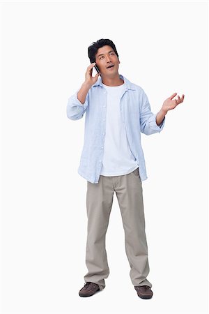 simsearch:400-06632132,k - Male talking on the cellphone against a white background Stock Photo - Budget Royalty-Free & Subscription, Code: 400-06632282