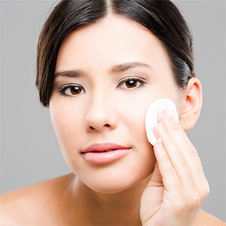 Beauty portrait of an Asian young woman cleaning the face with cotton Stock Photo - Budget Royalty-Free & Subscription, Code: 400-06633426