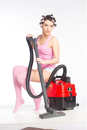 pavelshlykov (artist) - Funny girl with hair curlers on her head with vacuum cleaner isolated on white Stock Photo - Budget Royalty-Free & Subscription, Code: 400-06633594