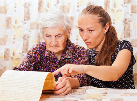 elder care - Young sweet lady holds the elderly woman's hand Stock Photo - Budget Royalty-Free & Subscription, Code: 400-06633829