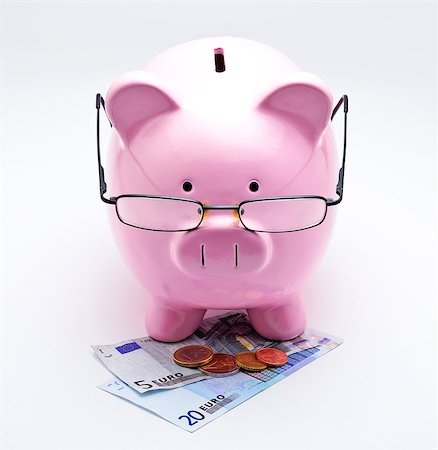 Piggy bank with glasses on Euros illustrating concepts of money Stock Photo - Budget Royalty-Free & Subscription, Code: 400-06644013