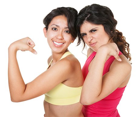 female flexing biceps - Smiling fit female friends flexing their biceps Stock Photo - Budget Royalty-Free & Subscription, Code: 400-06640878