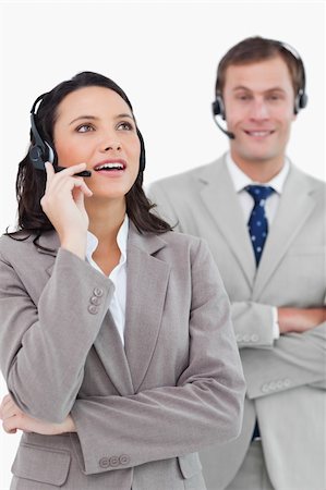 simsearch:400-03933798,k - Call center agents standing together against a white background Stock Photo - Budget Royalty-Free & Subscription, Code: 400-06685574