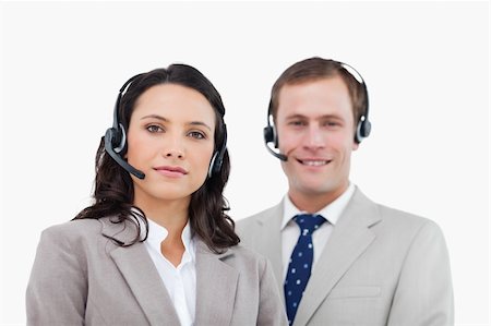 simsearch:400-03933798,k - Young call center agents standing together against a white background Stock Photo - Budget Royalty-Free & Subscription, Code: 400-06685576