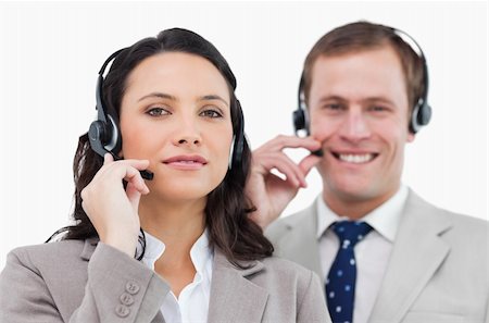 simsearch:400-03933798,k - Call center team with their headsets against a white background Stock Photo - Budget Royalty-Free & Subscription, Code: 400-06685578