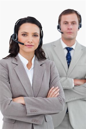 simsearch:400-03933798,k - Call center agents with headsets and arms folded against a white background Stock Photo - Budget Royalty-Free & Subscription, Code: 400-06685571