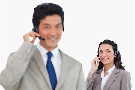 simsearch:400-03933798,k - Young call center team against a white background Stock Photo - Budget Royalty-Free & Subscription, Code: 400-06685612
