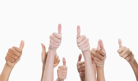 Thumbs-up against white background Stock Photo - Budget Royalty-Free & Subscription, Code: 400-06688138