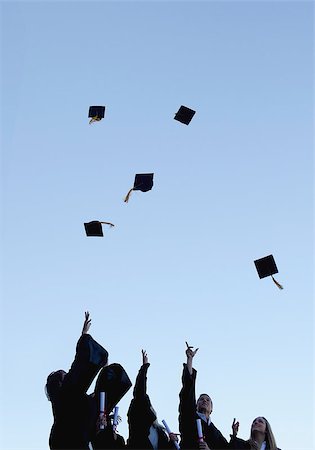 simsearch:400-06688304,k - Low angle-shot of five grad students throwing their hats high in the sky Photographie de stock - Aubaine LD & Abonnement, Code: 400-06688304