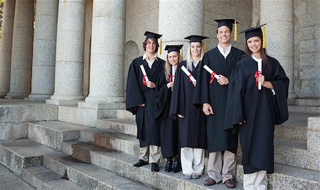 simsearch:400-06688304,k - Five happy graduates posing in front of the university Photographie de stock - Aubaine LD & Abonnement, Code: 400-06688407
