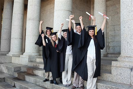 simsearch:400-06688304,k - Five happy graduates posing the arms raised in front of the university Photographie de stock - Aubaine LD & Abonnement, Code: 400-06688409