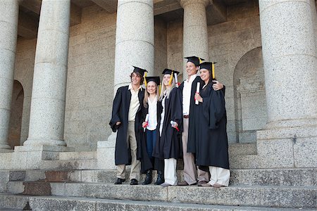 simsearch:400-06688304,k - Five graduates posing while holding their diploma in front of the university Photographie de stock - Aubaine LD & Abonnement, Code: 400-06688402