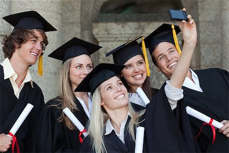 simsearch:400-06688304,k - Close-up of five graduates taking a picture of themselves in front of the university Photographie de stock - Aubaine LD & Abonnement, Code: 400-06688414