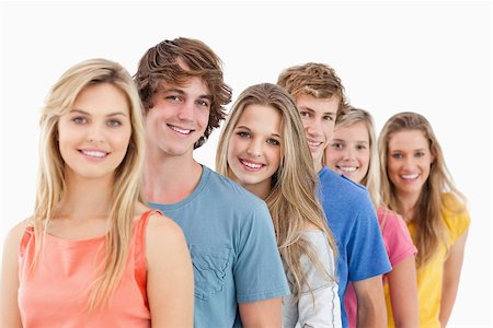 female white background full body - A smiling group standing behind each other at an angle while looking into the camera Stock Photo - Budget Royalty-Free & Subscription, Code: 400-06688988