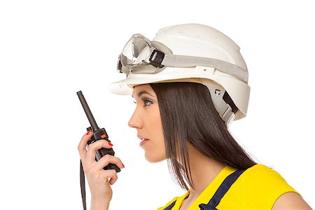 Serious female construction worker talking with a walkie talkie Stock Photo - Budget Royalty-Free & Subscription, Code: 400-06694129