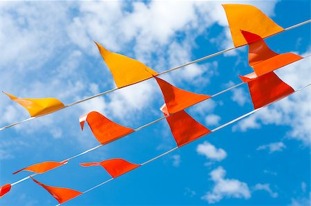 simsearch:400-06628533,k - red and orange bunting flags against a blue sky Stock Photo - Budget Royalty-Free & Subscription, Code: 400-06694470