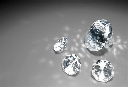 simsearch:694-03783247,k - a closeup of a group of three small diamonds and a bigger one are lying down on a grey surface with some reflections of light around them Stock Photo - Budget Royalty-Free & Subscription, Code: 400-06695150