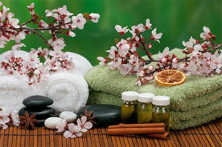 Spa concept with massage oils, cotton towels, aromatic spices, and healing pebbles Stock Photo - Budget Royalty-Free & Subscription, Code: 400-06696886