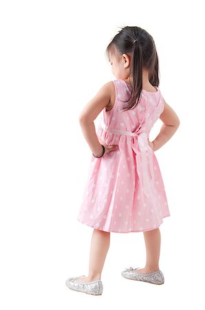 Full body rear view Asian girl in pink dress standing on white background Photographie de stock - Aubaine LD & Abonnement, Code: 400-06697986
