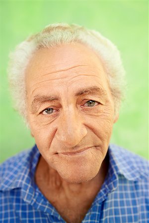 simsearch:400-06142278,k - Senior men and feelings, portrait of happy old caucasian man looking at camera on green background Stock Photo - Budget Royalty-Free & Subscription, Code: 400-06698767