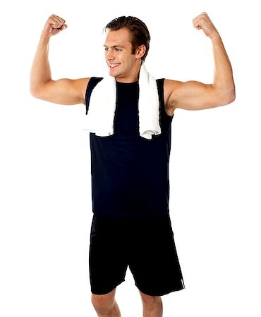 simsearch:400-06482604,k - Young fit guy showing biceps. Towel around his neck Stock Photo - Budget Royalty-Free & Subscription, Code: 400-06699785