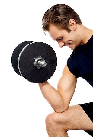 simsearch:400-06482604,k - Portrait of young fit trainer working out with dumbbells isolated over white Stock Photo - Budget Royalty-Free & Subscription, Code: 400-06699786