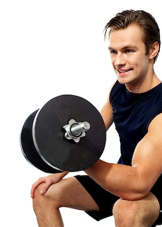 simsearch:400-06859193,k - Strong young man working out with dumbbells. Shot in studio on a white background Stock Photo - Budget Royalty-Free & Subscription, Code: 400-06699787
