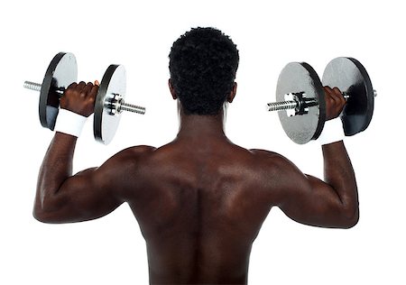 simsearch:400-06482604,k - Rear view of a young male bodybuilder doing heavy weight exercise with dumbbells Stock Photo - Budget Royalty-Free & Subscription, Code: 400-06699824