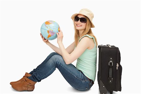 Woman holding a world globe while smiling against white background Stock Photo - Budget Royalty-Free & Subscription, Code: 400-06690189