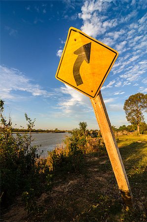 simsearch:400-05696622,k - Turn left symbol and sky in the countryside Stock Photo - Budget Royalty-Free & Subscription, Code: 400-06693133