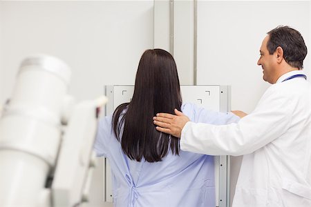 Doctor proceeding a mammography on a patient in an examination room Stock Photo - Budget Royalty-Free & Subscription, Code: 400-06734177