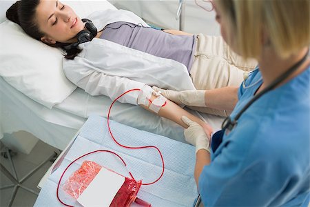 Nurse removing the transfusion in hospital ward Stock Photo - Budget Royalty-Free & Subscription, Code: 400-06734599