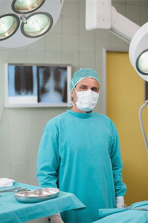 simsearch:400-06734297,k - Serious surgeon standing in operating theater Stock Photo - Budget Royalty-Free & Subscription, Code: 400-06734902