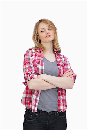 Front view of a woman upset against a white background Stock Photo - Budget Royalty-Free & Subscription, Code: 400-06735254