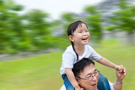 Happy family man running with daughter on his shoulders Stock Photo - Budget Royalty-Free & Subscription, Code: 400-06736451