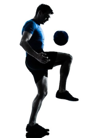 one caucasian man playing soccer football player silhouette  in studio isolated on white background Stock Photo - Budget Royalty-Free & Subscription, Code: 400-06738025