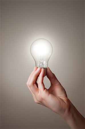 Hand holding a glowing light bulb Stock Photo - Budget Royalty-Free & Subscription, Code: 400-06738970