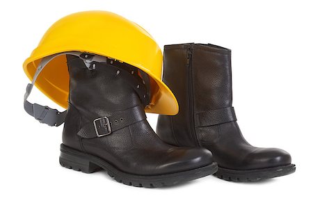 Boots and yellow hard hat over white background, small natural shadow under boots Stock Photo - Budget Royalty-Free & Subscription, Code: 400-06740218