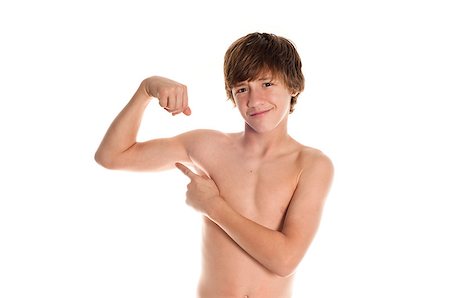 Young teen boy flexing and point at bicep with confidence.  Isolated on white background. Stock Photo - Budget Royalty-Free & Subscription, Code: 400-06740665